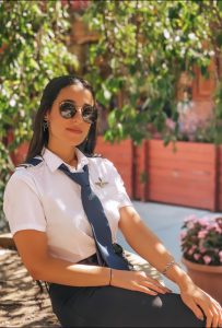 Captain Nadeen Qatameen in Full Pilot Uniform and Aviator Glasses